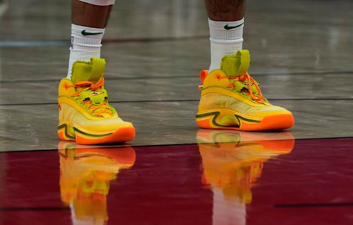 Green, yellow, and orange Air Jordan shoes.